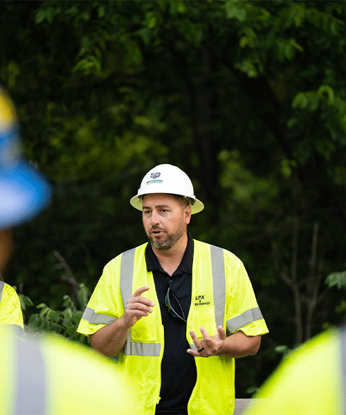 Construction worker in hard hat speak to his fellow employees in Kentuckiana