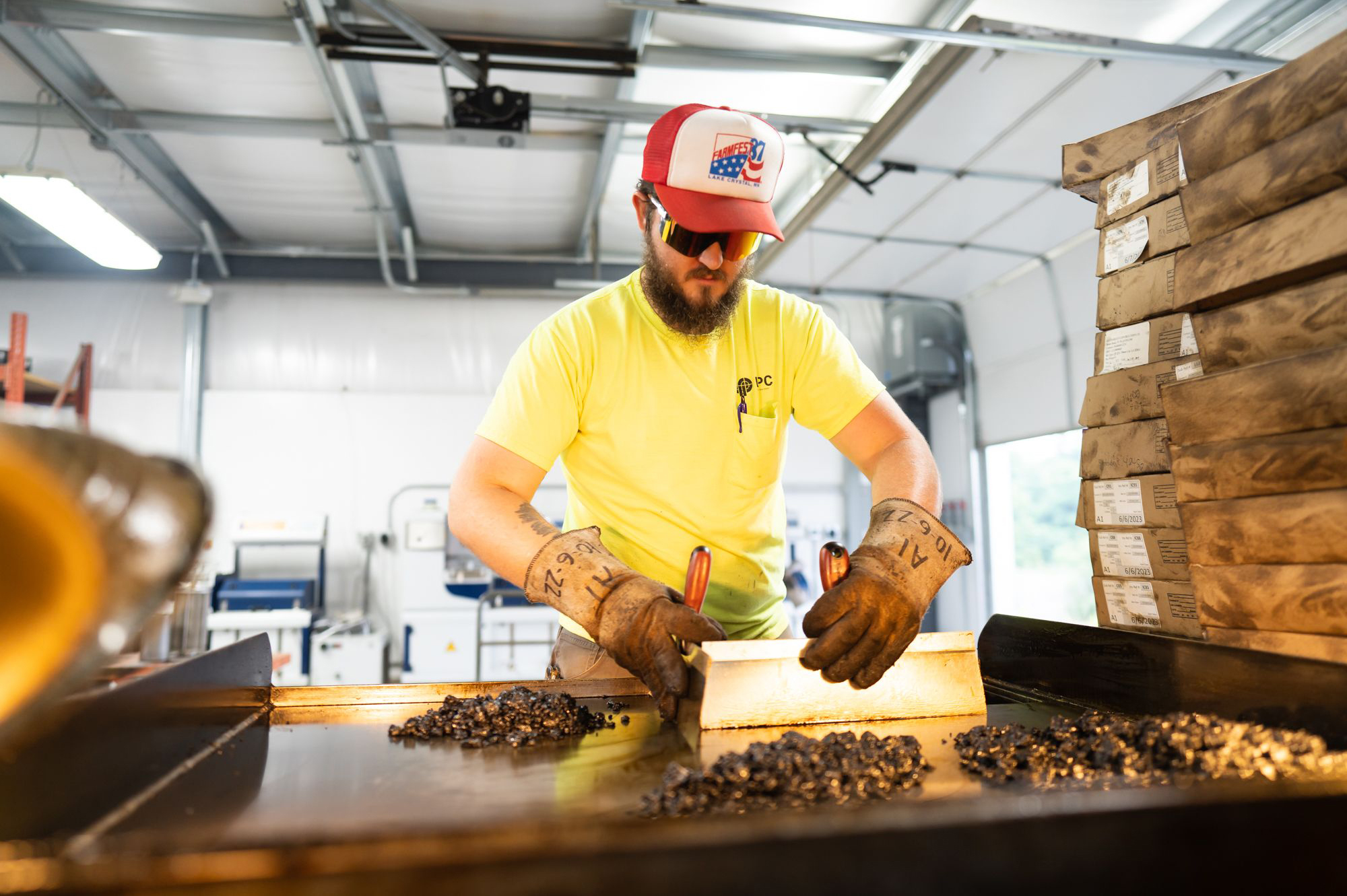 A Bluegrass Testing employee performs material testing on asphalt in Kentuckiana